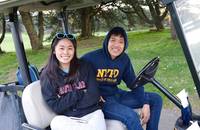 3/2/2020 at Lincoln Park
Lowell team manager Lauren Shew monitoring the action of the squad from hole to hole.  Her man servant Brandon Chang chauffeurs her around as not to miss any of the thrilling competition
Lauren was quoted, "Quite possibly the best boys golf I have witnessed this afternoon!"